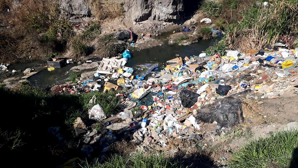 The Hennops River filled with pollution and litter