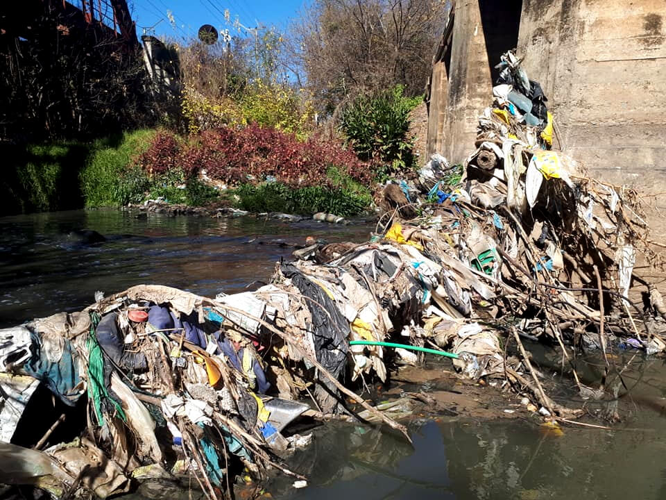 Trash flowing down the Hennops River - Centurion