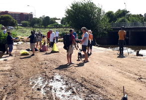 Normal people helping to change the polluted state of the Hennops River in Riverside Park